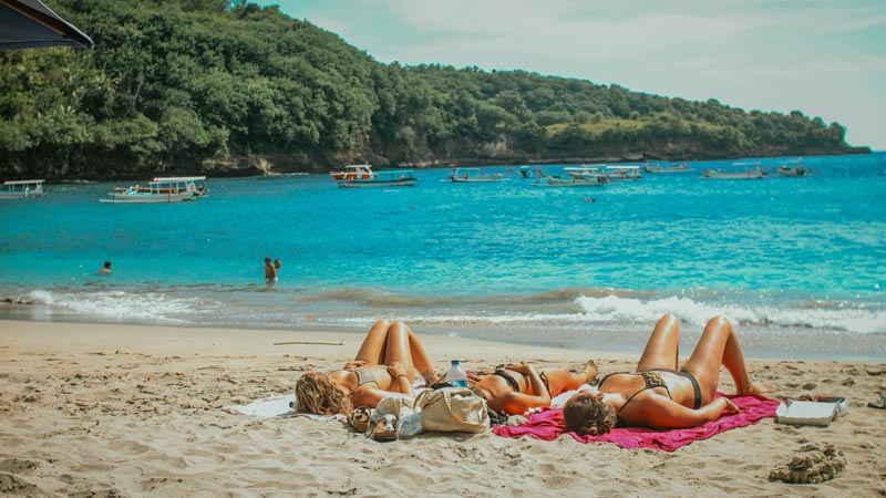 Tourists relaxing on secluded Virgin Beach