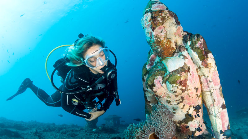 Diver exploring vibrant coral reefs in Bali