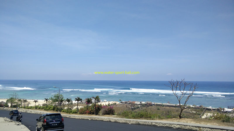 Panoramic view of Pandawa Beach with its calm turquoise waters and expansive shoreline.