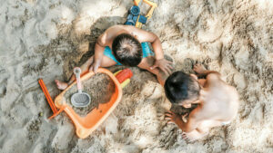 Children playing in the sand on a Bali beach