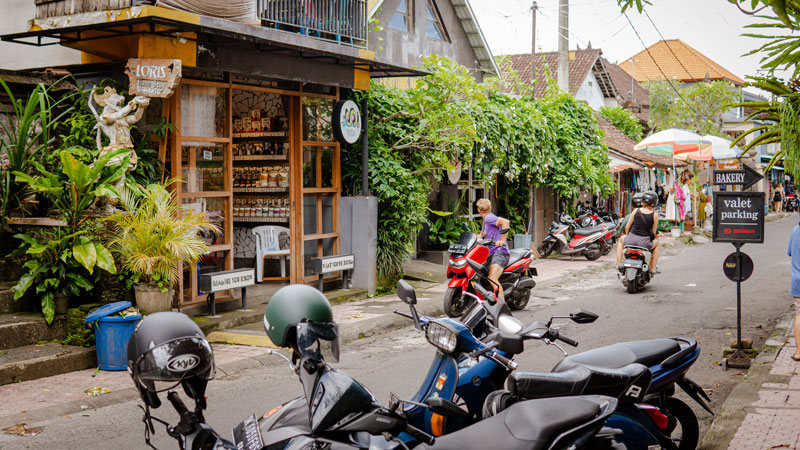 Motorbike parking in front of Seniman Coffee Studio Ubud, a favorite destination for young people