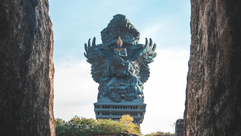 Imposing Garuda Wisnu Kencana statue towering amidst the Balinese landscape