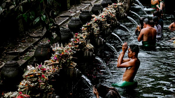 Purification rituals at Tirta Empul Water Temple in Bali