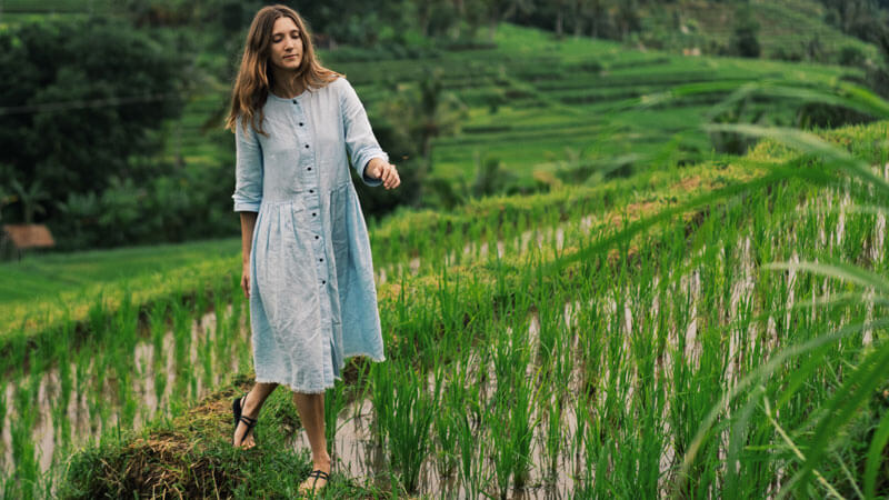 Tourist walking through Jatiluwih Rice Terraces in Bali after paying the Jatiluwih Rice Terrace Entrance Fees