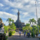 Bajra Sandhi Monument in Denpasar Bali, a towering structure amidst tropical greenery symbolizing Balinese struggle for independence.