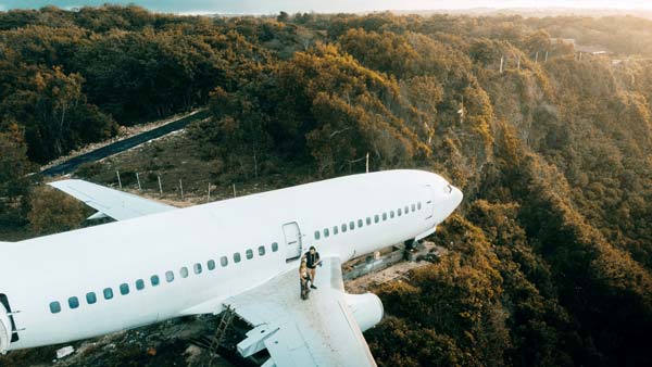 Boeing 737-200 Airplane Over the Cliffs In Uluwatu Bali