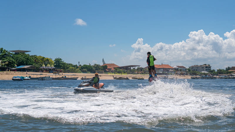 Thrill-seeker flyboarding above the waters, Eternal Adventures for Bali's Young Travelers