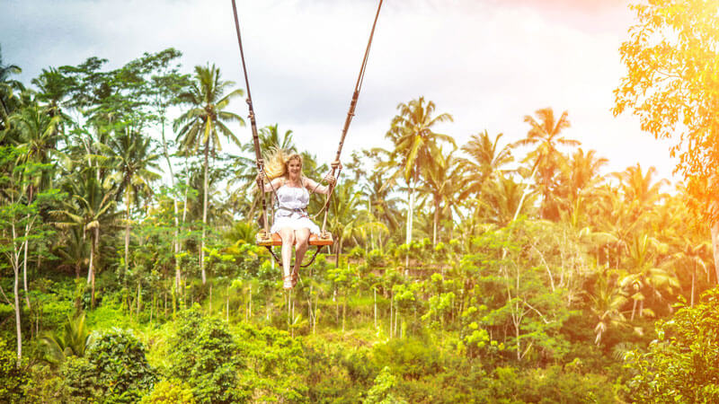 Swinging high over Bali's lush valleys and forests with the Bali Swing Adventure.