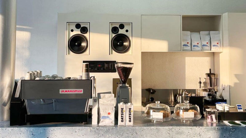 Sleek coffee machine and fresh pastries displayed at HANAKA COFFEE Denpasar