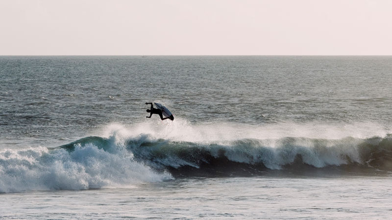 Surfer enjoying waves at Medewi Beach