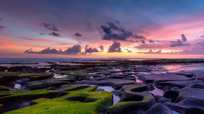 View of the sun setting on Medewi Beach