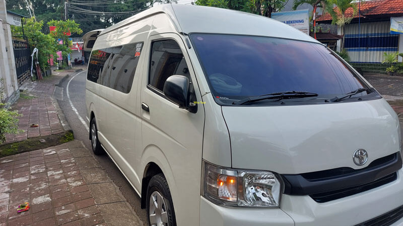 White Toyota Hiace van ready for a comfortable Bali tour with a driver