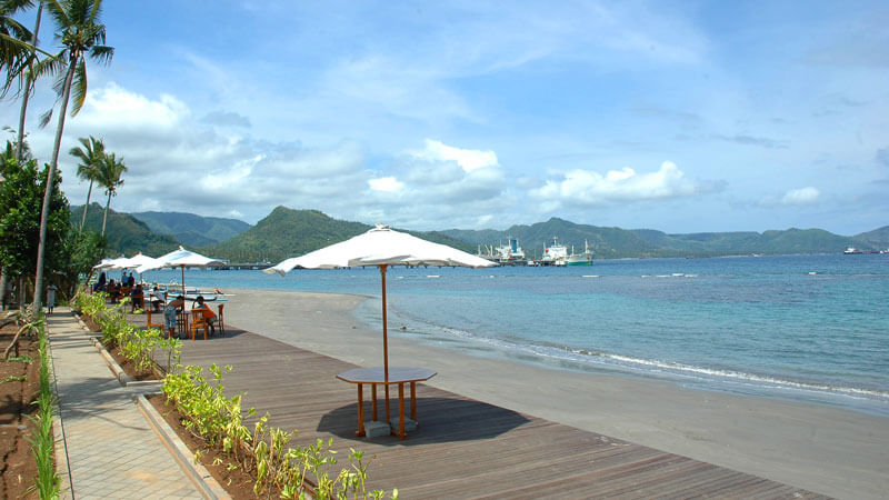 Beachfront relaxation area with umbrellas at Labuhan Amuk Beach in Karangasem, Bali