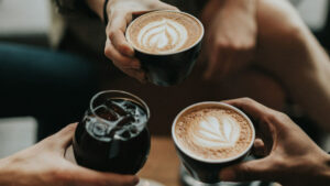 Friends enjoying coffee at a beachside cafe in Tanjung Benoa, Bali