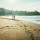 Serene beachscape with footprints in sand at dawn in East Bali