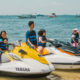 Family with children in life jackets ready for a jet ski ride in Bali