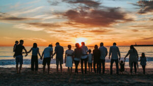 Family enjoying a beautiful sunset together on a Bali beach