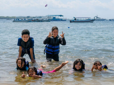 Children Having Fun on Bali Beach in Water Sports Clothes