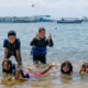 Children Having Fun on Bali Beach in Water Sports Clothes