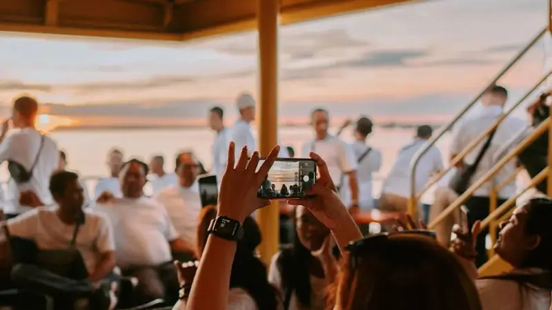 Passengers enjoy the sunset on Luxury Cruise