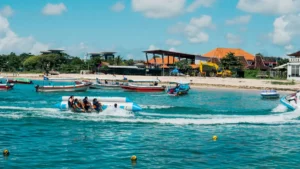 Tourists enjoying a Banana Boat ride as part of the Banana Boat Parasailing Package in Tanjung Benoa.