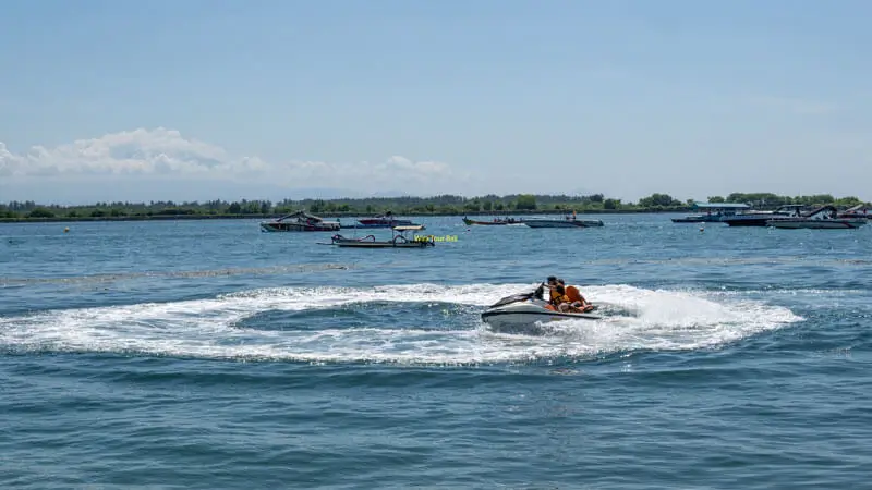 First-time Jet Ski riders making a circle in calm waters during a short beginner session at Tanjung Benoa.