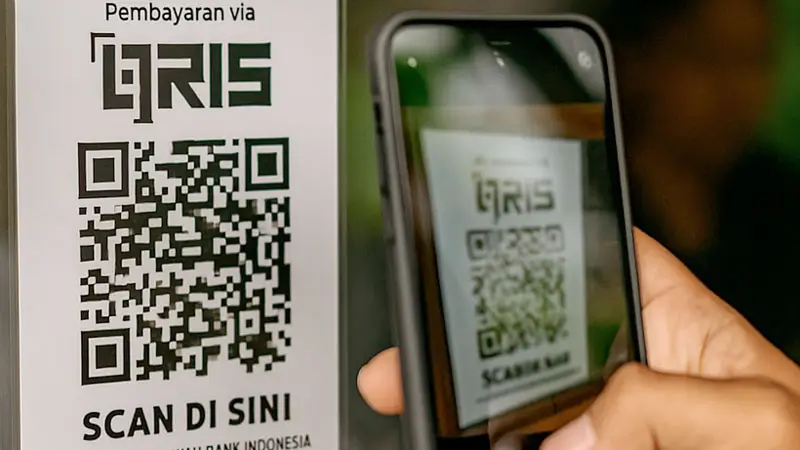 QRIS payment code at ticket counter, accepted along with cash