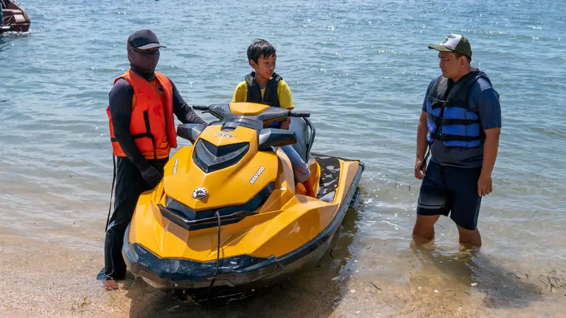 Bali jet ski shoreline briefing with life jackets before a beginner ride
