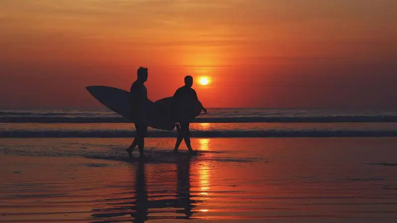 Kuta Beach sunset walk on the long bay in South Bali.