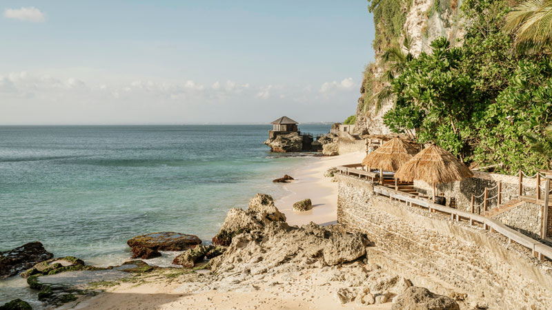 Cliffside beach with clear water near Jimbaran on Bukit Peninsula