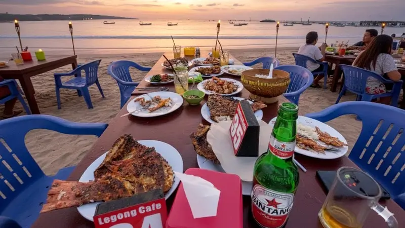 Jimbaran nightlife with grilled seafood dinner on the beach at sunset and calm waves in the bay