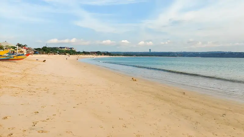 Sandy shoreline at Kedonganan Beach in the daytime