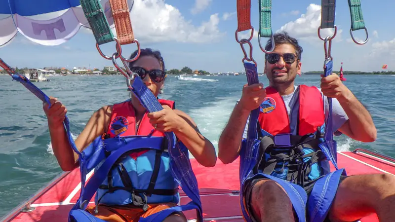 Harness and life jackets fitted before tandem flight in Tanjung Benoa