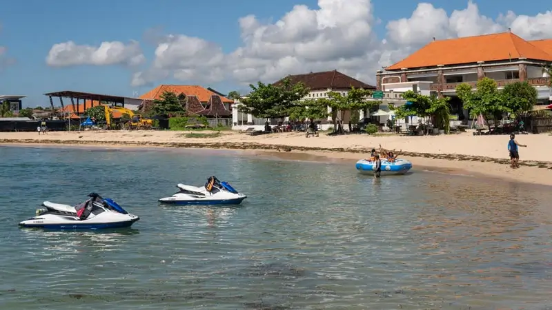 Jet skis parked in shallow water at Tanjung Benoa Beach