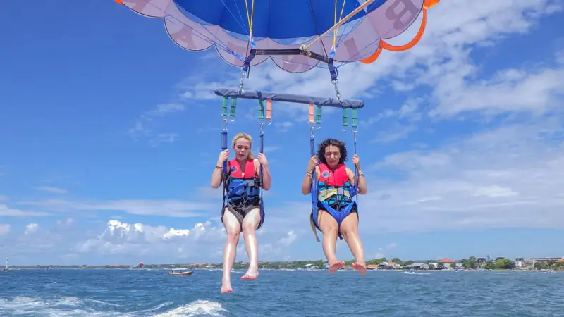 Tandem parasailing above the ocean in Tanjung Benoa