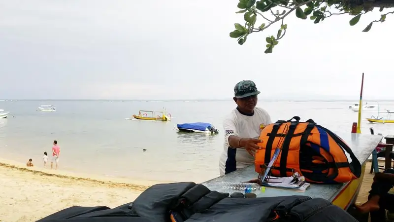 Life jacket prep at Sanur watersports beach before the ride