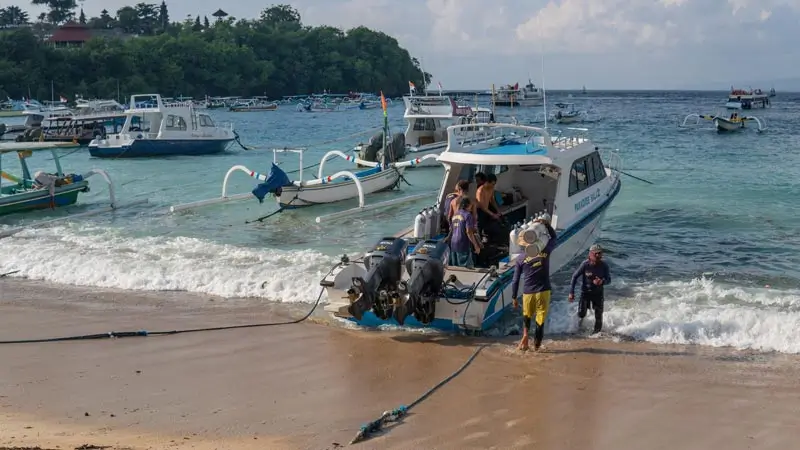 Scuba boat landing on a sandy beach Padang Bai Bali before a reef day