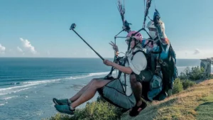 Tandem paragliding over the coast from Timbis Flying Site, Kutuh