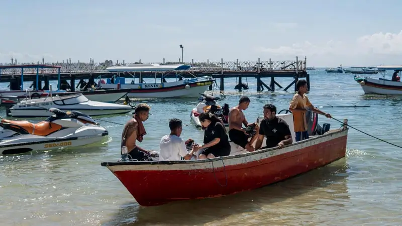 Small boat at Tanjung Benoa used for water activities and dive trips