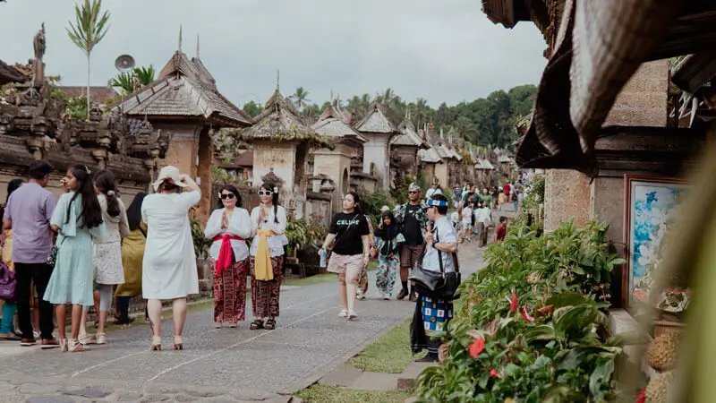 Visitors in a traditional Balinese village, one of Bali's cultural highlights