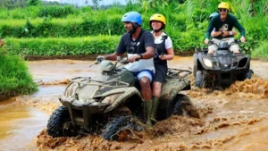 ATV riders on a muddy track as a Bali adventure activity