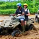 ATV riders on a muddy track as a Bali adventure activity