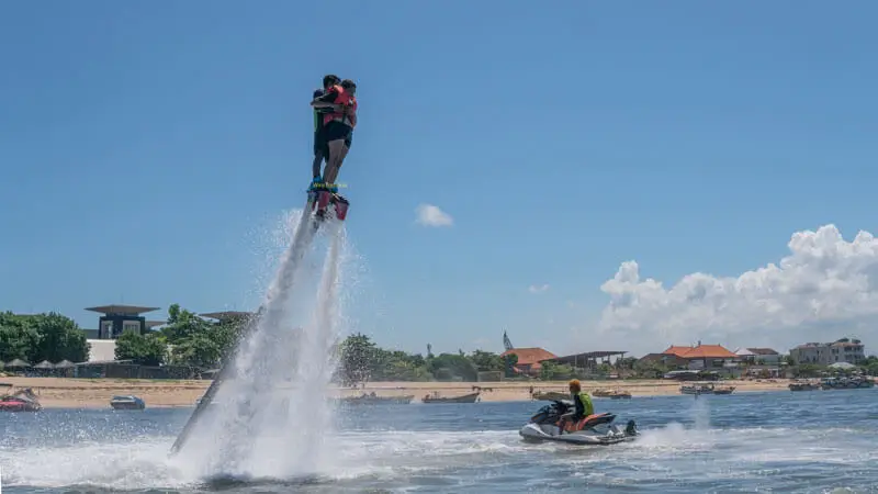 Flyboard participant with guide assistance in Tanjung Benoa