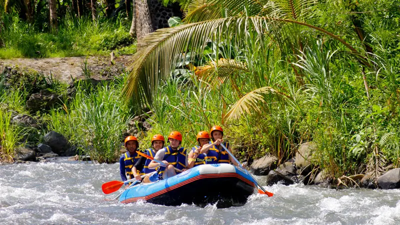 Group rafting on a Bali river as a guided adventure activity