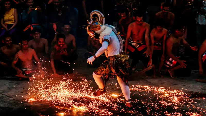 Kecak Dance performer near Sparks during an evening show