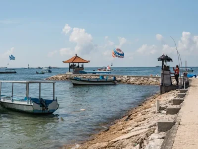 Tanjung Benoa Beach coastline with boats and a coastal path
